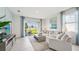 Bright living room with sliding glass doors leading to backyard patio at 31526 Ancient Sage Rd, Wesley Chapel, FL 33545