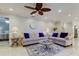 Spacious living room featuring a sectional sofa and a coffee table at 3540 Indigo Pond Dr # 1, Palm Harbor, FL 34685