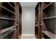 Spacious walk-in closet with ample shelving and hanging space at 3540 Indigo Pond Dr # 1, Palm Harbor, FL 34685