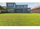 Expansive backyard offering ample space for recreation and outdoor activities at 4383 Ortona Ln, Wesley Chapel, FL 33543