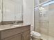 Updated bathroom with walk-in shower and toilet at 4383 Ortona Ln, Wesley Chapel, FL 33543