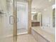 Spa-like bathroom featuring a large shower and a relaxing tub at 4383 Ortona Ln, Wesley Chapel, FL 33543