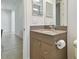 Neutral powder room with storage under sink at 4383 Ortona Ln, Wesley Chapel, FL 33543