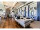 Elegant clubhouse lounge featuring stylish seating, a stone fireplace, and large windows with natural light at 4383 Ortona Ln, Wesley Chapel, FL 33543