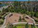 Community playground featuring slides, swings, shaded seating, and surrounding greenery at 4383 Ortona Ln, Wesley Chapel, FL 33543