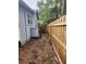 Long, narrow backyard with wooden fence and storage shed at 485 11Th N Ave, St Petersburg, FL 33701