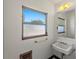 Clean bathroom featuring a pedestal sink and window at 5021 24Th S Ave, Gulfport, FL 33707