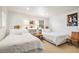 Guest bedroom with twin beds, built-in shelving, and artwork at 5021 24Th S Ave, Gulfport, FL 33707