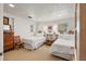 Guest bedroom with twin beds, built-in shelving, and window seat at 5021 24Th S Ave, Gulfport, FL 33707