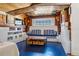 Cozy den with a built-in window seat and blue painted floor at 5021 24Th S Ave, Gulfport, FL 33707