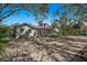 House with a large gravel driveway and a pathway to the back at 5021 24Th S Ave, Gulfport, FL 33707