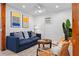 Bright living room with blue sofa and coastal decor at 5021 24Th S Ave, Gulfport, FL 33707