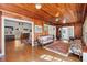 Sun-drenched living area with wood walls and hardwood floors at 5021 24Th S Ave, Gulfport, FL 33707