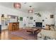 Living room with hardwood floors, a home bar, and comfortable seating at 5021 24Th S Ave, Gulfport, FL 33707