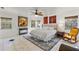 Large bedroom with a king-size bed and a yellow rocking chair at 5021 24Th S Ave, Gulfport, FL 33707