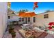 Inviting patio with colorful rug, seating area, and umbrella at 5021 24Th S Ave, Gulfport, FL 33707