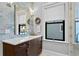 Modern bathroom with dark vanity and blue tile backsplash at 5104 Homer W Ave, Tampa, FL 33629