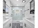 Modern bathroom with marble shower and double vanity at 5421 7Th N Ave, St Petersburg, FL 33710