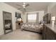 Bedroom with gray dresser, full bed, and carpet at 5501 80Th N St # 214, St Petersburg, FL 33709