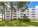 Building exterior with well maintained lawn and landscaping at 5501 80Th N St # 214, St Petersburg, FL 33709