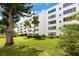 Building exterior showcasing manicured landscaping and lush greenery at 5501 80Th N St # 214, St Petersburg, FL 33709