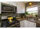 Modern kitchen with stainless steel appliances and updated backsplash at 5501 80Th N St # 214, St Petersburg, FL 33709