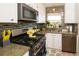 Modern kitchen with stainless steel appliances and updated backsplash at 5501 80Th N St # 214, St Petersburg, FL 33709
