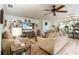 Living Room with light brown sofas and a large TV at 5501 80Th N St # 214, St Petersburg, FL 33709