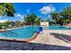 Inviting community pool with a ramp for accessibility at 5501 80Th N St # 214, St Petersburg, FL 33709