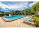 Refreshing community pool with lounge chairs, perfect for relaxation at 5501 80Th N St # 214, St Petersburg, FL 33709