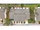Aerial view of townhome complex featuring well-maintained roofs, landscaping, and convenient parking spaces at 6262 93Rd N Ter # 3904, Pinellas Park, FL 33782