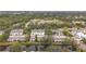Aerial view of community, showcasing townhouses and a tranquil canal at 6262 93Rd N Ter # 3904, Pinellas Park, FL 33782