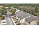 Aerial view of townhouses situated along a quiet street and canal at 6262 93Rd N Ter # 3904, Pinellas Park, FL 33782