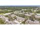 Aerial view of townhomes highlighting proximity to water, lush greenery, and neighborhood streets at 6262 93Rd N Ter # 3904, Pinellas Park, FL 33782