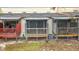View of the home's outdoor wooden porches in a backyard setting at 6262 93Rd N Ter # 3904, Pinellas Park, FL 33782
