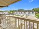 Balcony area overlooking the building complex with white wrought iron seating at 6262 93Rd N Ter # 3904, Pinellas Park, FL 33782