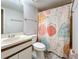 Bathroom featuring a sink vanity, toilet, and a shower with a patterned curtain at 6262 93Rd N Ter # 3904, Pinellas Park, FL 33782