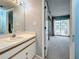 Bathroom features a vanity with sink and access to bedroom at 6262 93Rd N Ter # 3904, Pinellas Park, FL 33782