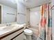 Cozy bathroom featuring a single sink vanity and bathtub with decorative shower curtain at 6262 93Rd N Ter # 3904, Pinellas Park, FL 33782