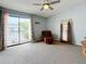 Serene bedroom with plush carpet, sliding glass doors and a view at 6262 93Rd N Ter # 3904, Pinellas Park, FL 33782