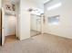 Bedroom with mirrored closet, carpeted floors, and cat wall decor with a bright open layout at 6262 93Rd N Ter # 3904, Pinellas Park, FL 33782