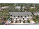 Exterior view of townhomes featuring attached garages, balconies, and landscaped front yards at 6262 93Rd N Ter # 3904, Pinellas Park, FL 33782