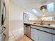 Kitchen boasts stainless steel dishwasher and a double sink at 6262 93Rd N Ter # 3904, Pinellas Park, FL 33782