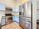 Kitchen with stainless steel appliances and light blue cabinets at 6262 93Rd N Ter # 3904, Pinellas Park, FL 33782