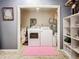 The dedicated laundry room includes a washer, dryer, and storage shelving at 6262 93Rd N Ter # 3904, Pinellas Park, FL 33782