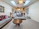 Bright living room featuring skylights, ceiling fan, and an open layout leading to the kitchen and staircase at 6262 93Rd N Ter # 3904, Pinellas Park, FL 33782