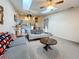 Open living room featuring a ceiling fan, skylights and unique decor throughout at 6262 93Rd N Ter # 3904, Pinellas Park, FL 33782