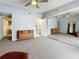 Spacious main bedroom featuring a large closet, ceiling fan, ensuite bathroom, and neutral carpet at 6262 93Rd N Ter # 3904, Pinellas Park, FL 33782