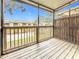 The outdoor porch features wood flooring, screened-in walls and a scenic view of the pond at 6262 93Rd N Ter # 3904, Pinellas Park, FL 33782