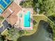 Community pool with plenty of lounge chairs at 6334 Spring Flower Dr # 15, New Port Richey, FL 34653